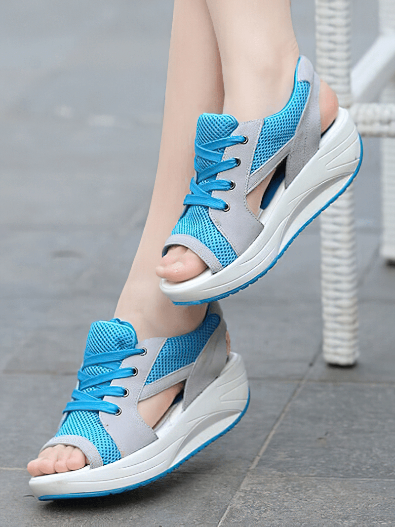 Blue lace-up women's sandals with thick soles, featuring open toe design and breathable air mesh upper.
